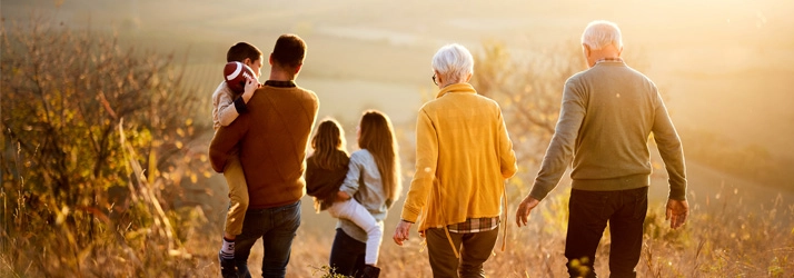 Chiropractic Auburn WA Family Hike A family walking in a field.
