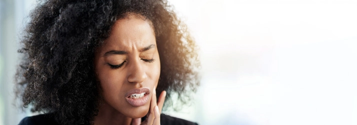 Chiropractic-Auburn-WA-Woman-with-Jaw-Pain.webp low back pain relief with chiropractic care
